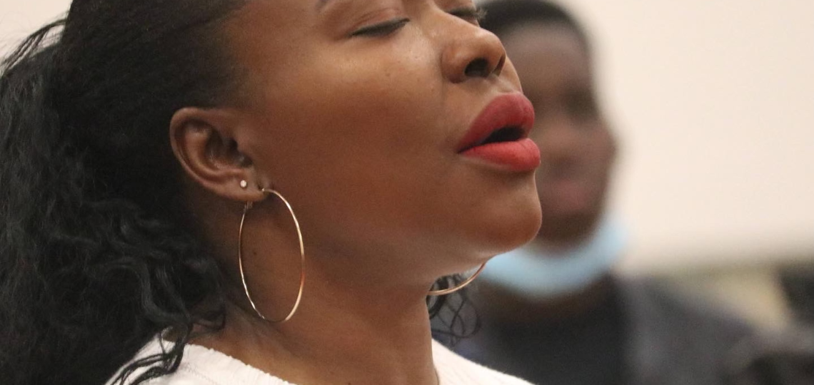 buki praying in church as she processes God's plan