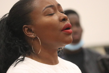 buki praying in church as she processes God's plan