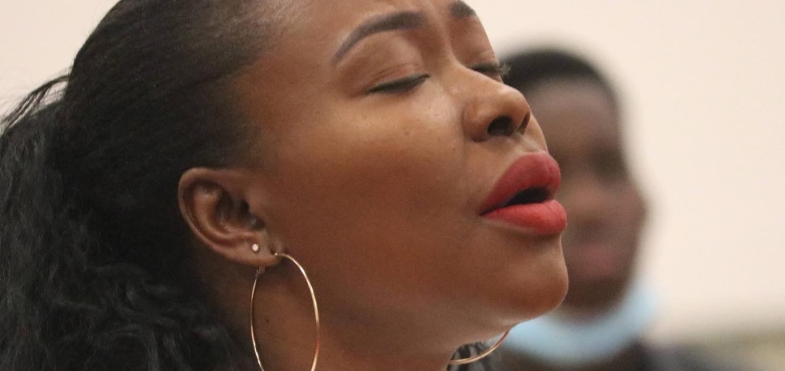 buki praying in church as she processes God's plan