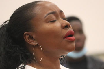 buki praying in church as she processes God's plan